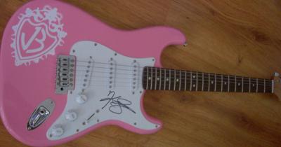 Kevin Jonas autographed pink Jonas Brothers Fender Bullet electric guitar