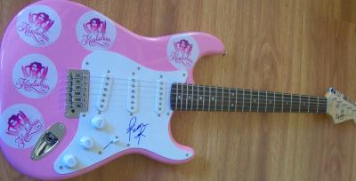 Kim Kardashian autographed pink Fender Bullet electric guitar