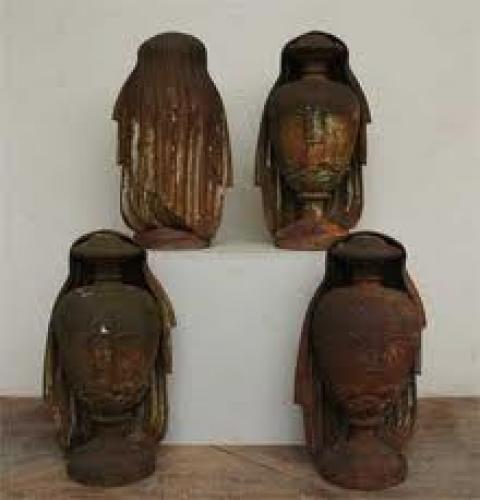 Four antiques cast iron decorative urns